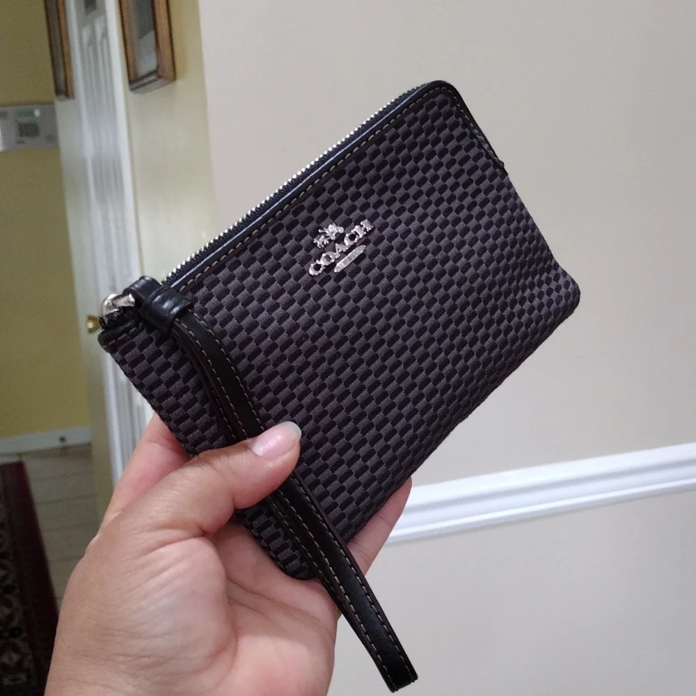 Black and gray checkered Coach Wristlet